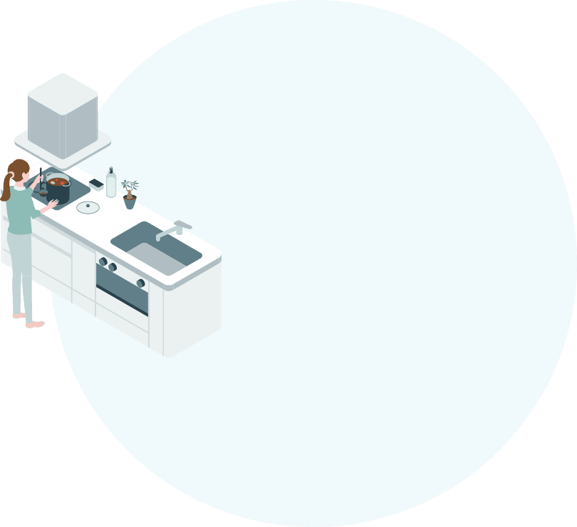 キッチンで料理する女性